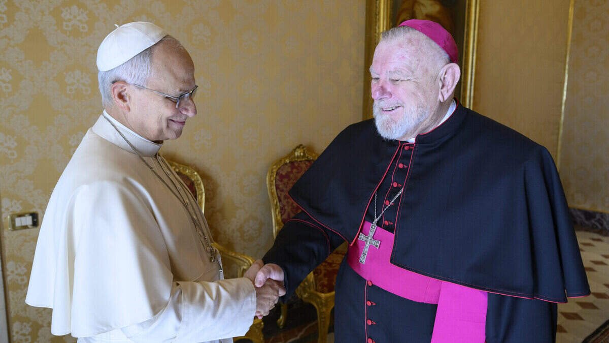 Pope Leo XIV and Archbishop Thomas Wenski shake hands during a meeting on Oct. 5, 2026, days before the pope underwent lung surgery.